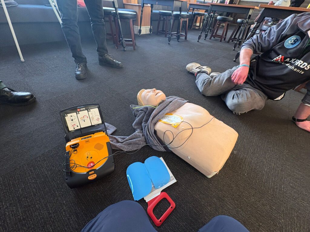 Students practicing First Aid with Manikins and AED devices