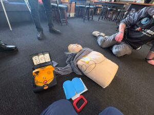 Students practicing First Aid with Manikins and AED devices