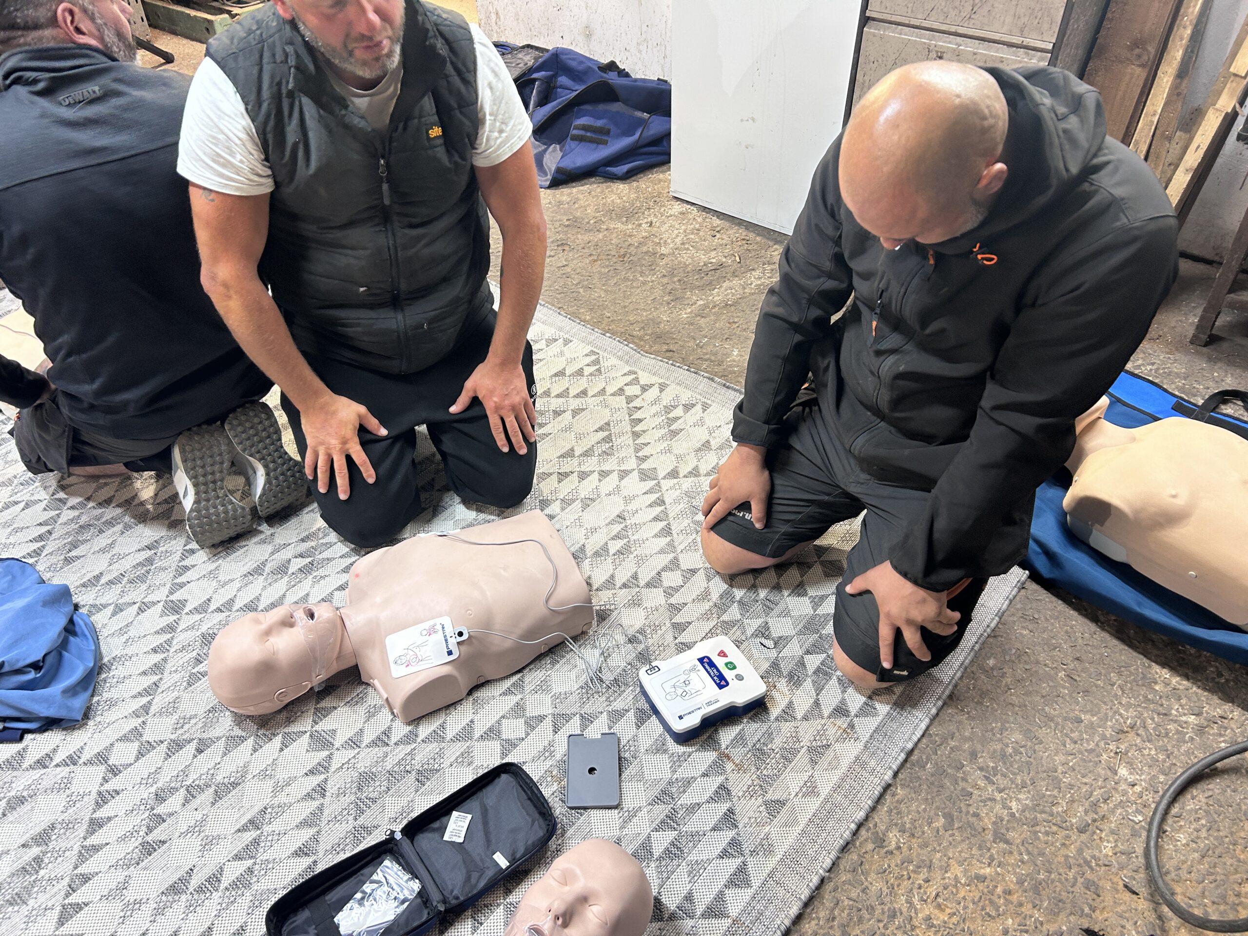 Delegates practising CPR during Emergency First Aid at Work training delivered by P3 First Aid Training